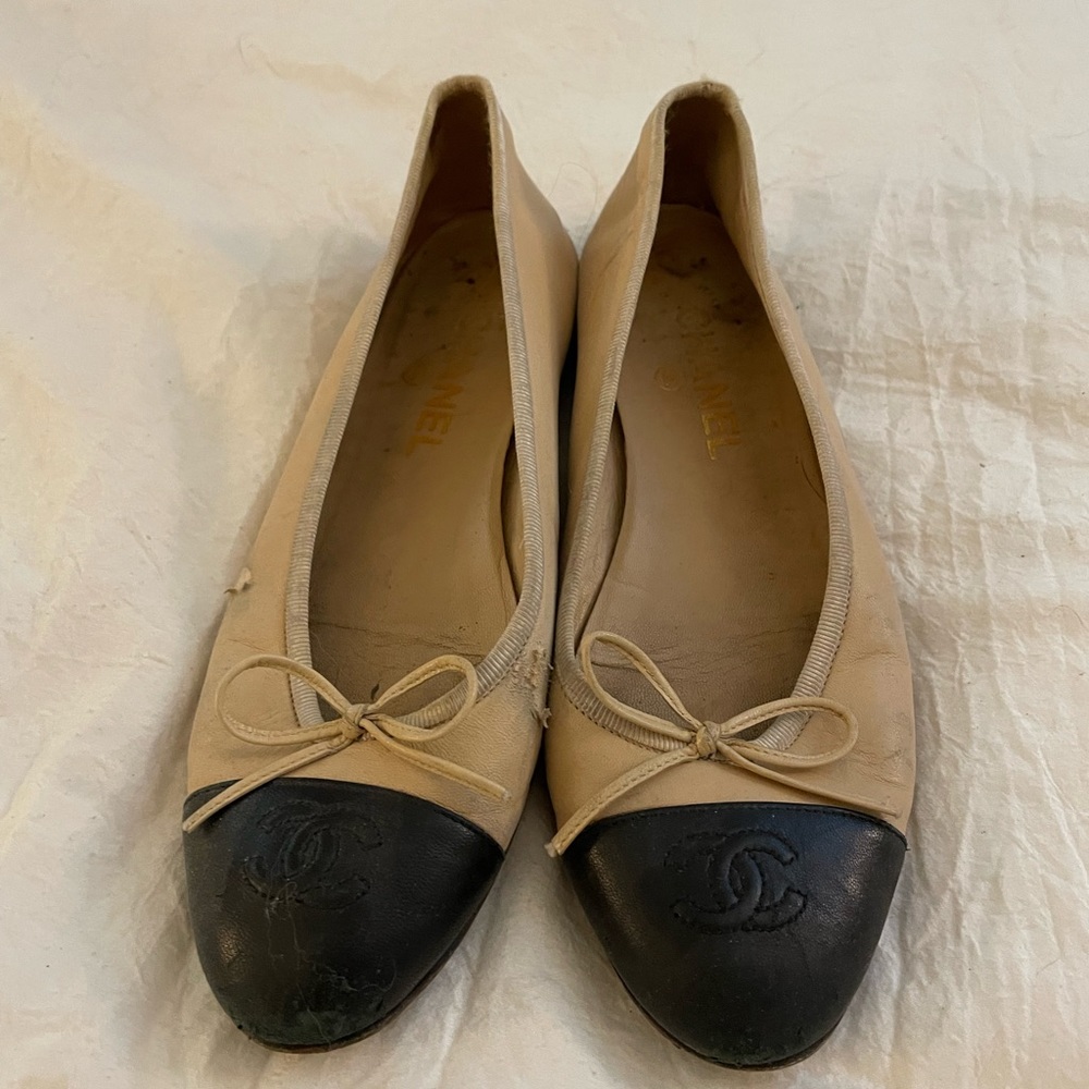 Very worn Chanel ballet flats.